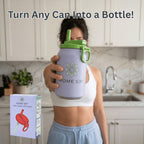 A woman in a kitchen holds a large light purple Home Sip can-shaped water bottle with a green lid and straw. The image includes the text 'Turn Any Can Into a Bottle!' at the top and shows the product box in the lower left corner.